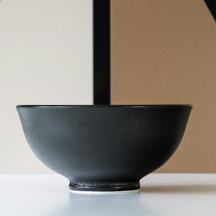 A dark glazed serving bowl