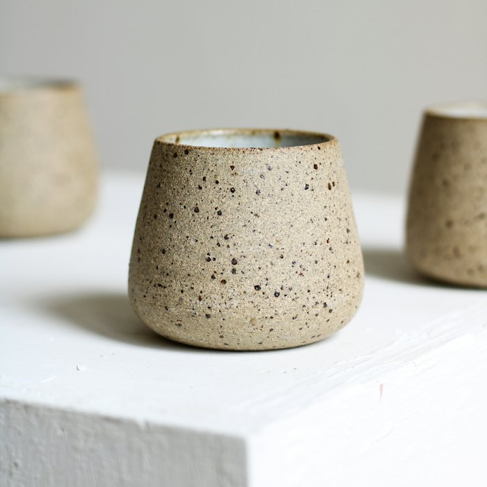 A speckled stoneware cup