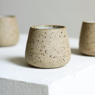 A speckled stoneware cup